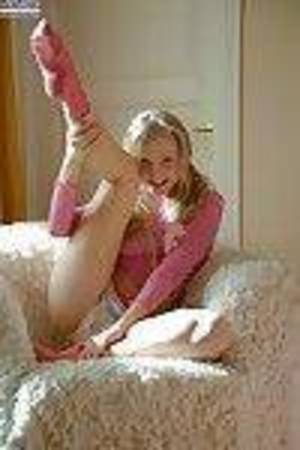 Frisky teenie in pink socks delightful off her shorts and fingering her slit