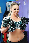 Busty cheerleader Abbey Brooks gives a titjob and gets fucked