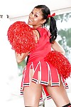 Ebony cheerleader babe poses gorgeously in her sexy red outfit
