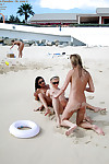 Undressed teen young darlings in sunglasses having some enjoyment on the beach