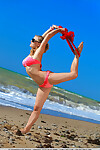 Amateur glamour example Alessandra A striptease off bikini on beach in sunglasses